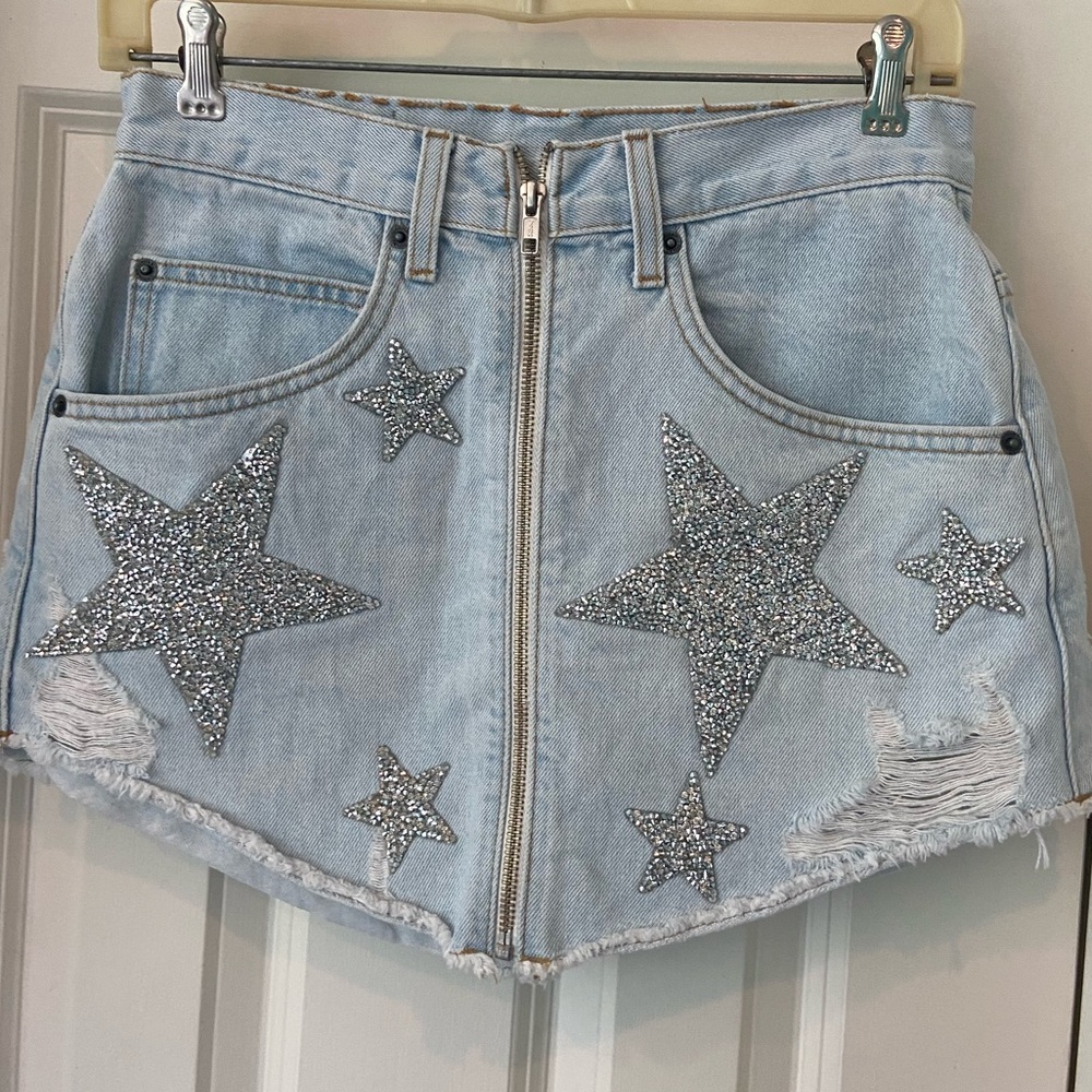 Carmar Jean skirt with star detailing. Size 27